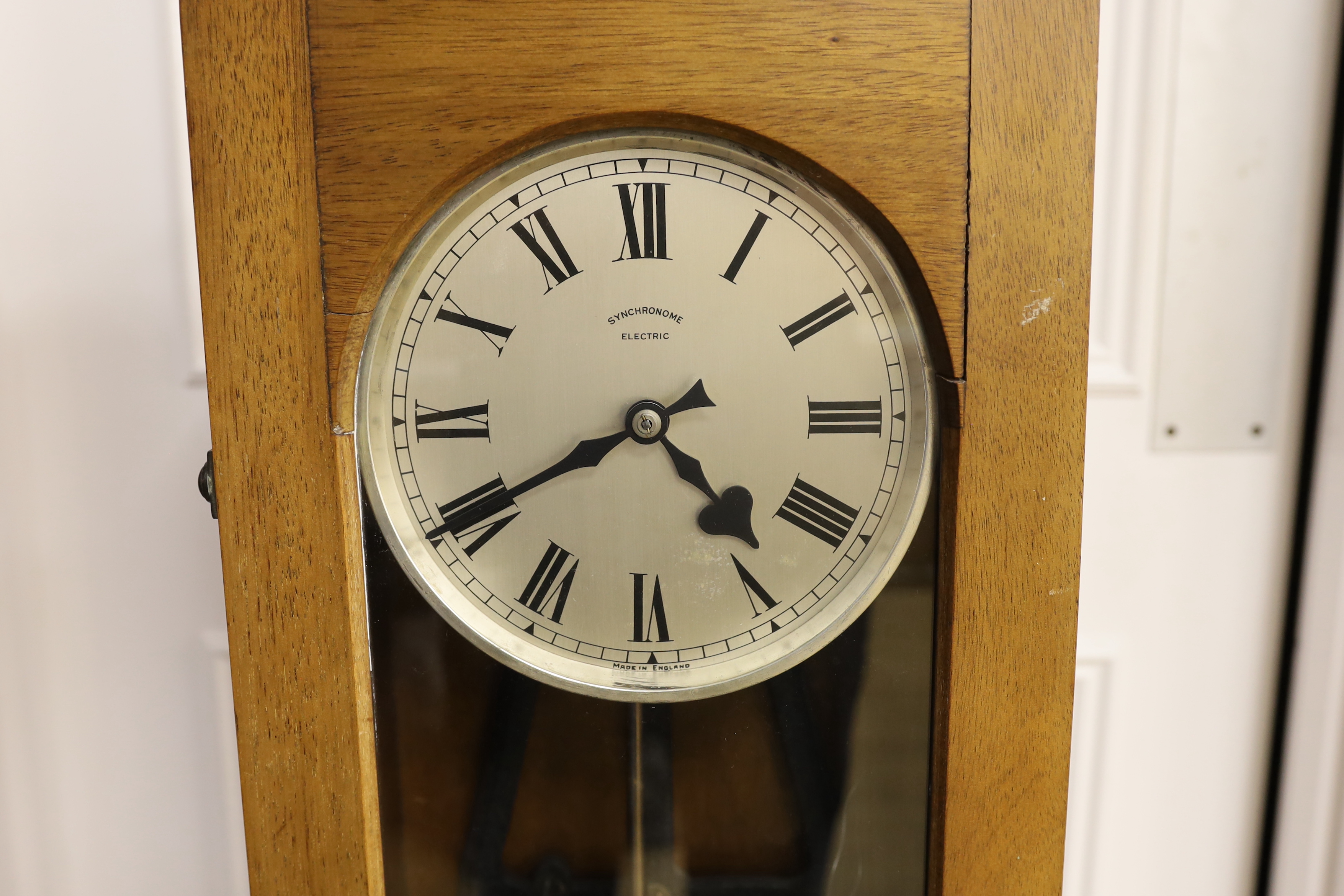 A Synchronome electric wall clock, 126.5cm high